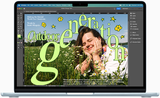 A MacBook Air displaying an Adobe InDesign project