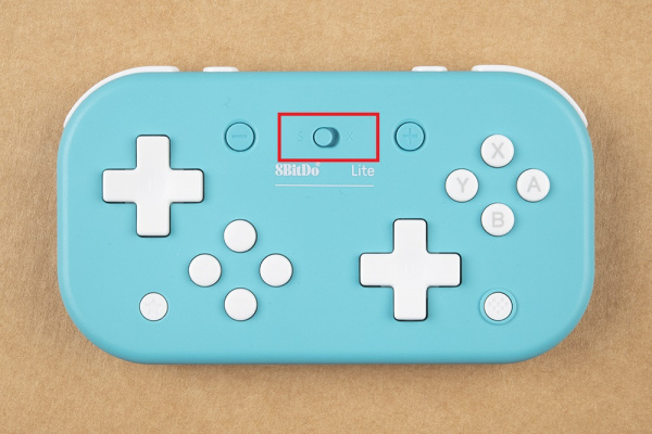 S and X switch is in the top middle of the controller 