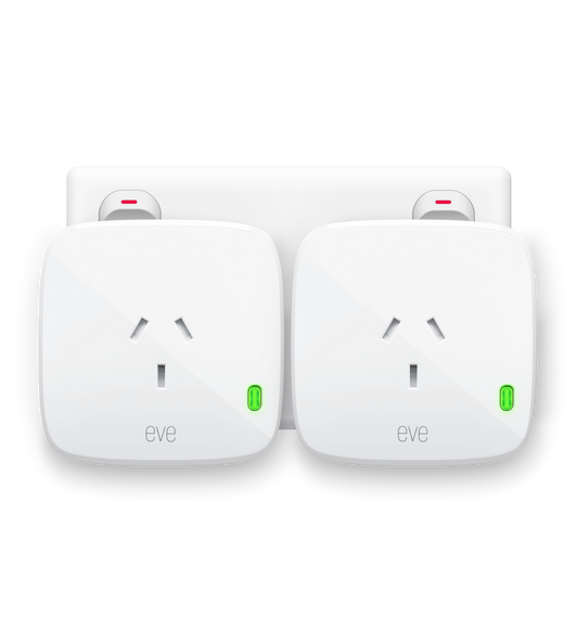  Two Eve Energys, Matter Version, plugged into a power socket with green LED power indicator showing it’s ON .